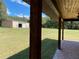 View from covered porch showing detached workshop at 1921 Smitty Rd, Lady Lake, FL 32159