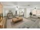 Open living room with fireplace and view into the kitchen at 1921 Smitty Rd, Lady Lake, FL 32159