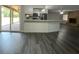 Open concept kitchen and living area with new flooring at 1921 Smitty Rd, Lady Lake, FL 32159