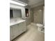 Updated bathroom with vanity, shower, and toilet at 1921 Smitty Rd, Lady Lake, FL 32159