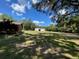 Large backyard with home and detached garage at 1921 Smitty Rd, Lady Lake, FL 32159