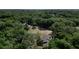Aerial view showing home, detached garage, and expansive wooded lot at 1921 Smitty Rd, Lady Lake, FL 32159