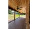 Covered porch with brick flooring and ceiling fan at 1921 Smitty Rd, Lady Lake, FL 32159