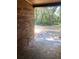 Brick patio with view of wooded backyard at 1921 Smitty Rd, Lady Lake, FL 32159