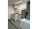 Bright laundry room with washer, dryer, and utility sink at 1921 Smitty Rd, Lady Lake, FL 32159