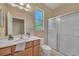 Bathroom with single vanity, shower, and toilet at 12176 Se 91St Ave, Summerfield, FL 34491