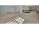 Open living room with tile and carpeted floors, and views to other rooms and patio at 12176 Se 91St Ave, Summerfield, FL 34491