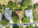 Aerial view of a house with a brown roof and green yard at 12176 Se 91St Ave, Summerfield, FL 34491