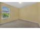 Light and airy bedroom with neutral walls and carpet at 12176 Se 91St Ave, Summerfield, FL 34491