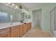 Double vanity bathroom with soaking tub, shower, and walk-in closet at 12176 Se 91St Ave, Summerfield, FL 34491