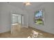 Bright office with tile floors and French doors opening to another room and a view of the backyard at 12176 Se 91St Ave, Summerfield, FL 34491