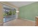 Bright kitchen with light wood cabinets, an island, and access to a screened patio at 12176 Se 91St Ave, Summerfield, FL 34491