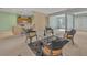 Open concept living room with kitchen views, seating area, and access to other areas at 12176 Se 91St Ave, Summerfield, FL 34491