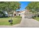 Single-story house with a two-car garage and manicured lawn at 12176 Se 91St Ave, Summerfield, FL 34491