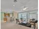 Open and bright living room with kitchen, seating area and access to other rooms at 12176 Se 91St Ave, Summerfield, FL 34491