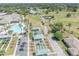 Aerial view of community pool, bocce ball courts, and golf course at 12176 Se 91St Ave, Summerfield, FL 34491