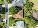 House with brown roof surrounded by lush greenery at 12176 Se 91St Ave, Summerfield, FL 34491