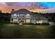 Two-story home with brick and siding exterior, and a landscaped lawn at 29334 David Ct, Tavares, FL 32778