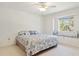 Bright bedroom with a window seat and ceiling fan at 29334 David Ct, Tavares, FL 32778