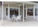 Covered patio with table and chairs, perfect for outdoor dining at 29334 David Ct, Tavares, FL 32778