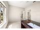Home office with desk and view to the staircase at 29334 David Ct, Tavares, FL 32778