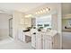 Elegant bathroom with dual vanities and a large mirror at 29334 David Ct, Tavares, FL 32778