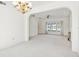 Bright dining room with chandelier and view to living room at 29334 David Ct, Tavares, FL 32778