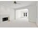 Bright living room featuring a fireplace and access to a formal dining area at 29334 David Ct, Tavares, FL 32778