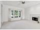 Bright living room with fireplace and window view at 29334 David Ct, Tavares, FL 32778