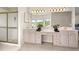 Double vanity bathroom with walk-in shower and water views at 29334 David Ct, Tavares, FL 32778