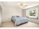 Bright bedroom with a window seat and ceiling fan at 29334 David Ct, Tavares, FL 32778