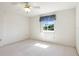 Spacious bedroom with a ceiling fan and window at 29334 David Ct, Tavares, FL 32778