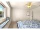 Bedroom with window seat and access to upper floor at 29334 David Ct, Tavares, FL 32778