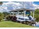 Covered boat storage with lift and access to the water at 29334 David Ct, Tavares, FL 32778