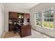 Bright home office with built-in desk and window view at 29334 David Ct, Tavares, FL 32778