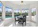 Breakfast nook with a round table and chairs, overlooking the pool area at 29334 David Ct, Tavares, FL 32778