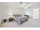 Main bedroom with a king-size bed and en-suite bathroom access at 29334 David Ct, Tavares, FL 32778
