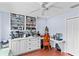 Bright craft room with built-in cabinets and a workspace at 122 Baytree Blvd, Tavares, FL 32778