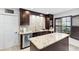 Island kitchen with granite countertops and a breakfast bar at 122 Baytree Blvd, Tavares, FL 32778