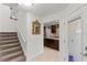 View of staircase leading to kitchen and exterior access at 122 Baytree Blvd, Tavares, FL 32778
