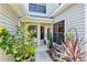 Private patio area with lush tropical plants at 122 Baytree Blvd, Tavares, FL 32778