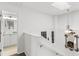 Upstairs hallway with bath access and a view of the lower level at 122 Baytree Blvd, Tavares, FL 32778
