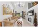 Spacious living room with high ceilings, fireplace and large TV at 122 Baytree Blvd, Tavares, FL 32778