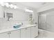 Clean bathroom with white vanity, a shower, and a tiled floor at 122 Baytree Blvd, Tavares, FL 32778