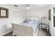 Well-lit bedroom with a comfortable sleigh bed, and window with black trim at 122 Baytree Blvd, Tavares, FL 32778