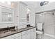 Updated bathroom with double vanity and shower at 122 Baytree Blvd, Tavares, FL 32778