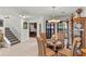 Bright dining area with view to kitchen and stairs at 122 Baytree Blvd, Tavares, FL 32778