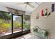 Relaxing screened porch with outdoor view and decorative accents at 122 Baytree Blvd, Tavares, FL 32778
