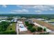 Aerial view showing property's location among greenhouses at 2103 W Kelly Park Rd, Apopka, FL 32712