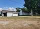 Detached garage with a carport next to the house at 2103 W Kelly Park Rd, Apopka, FL 32712